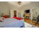 Large main bedroom with a king bed and brick fireplace at 2173 Anderson Se Ave, Covington, GA 30014
