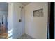 Walk-in shower with subway tile and pebble floor at 2173 Anderson Se Ave, Covington, GA 30014