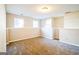 Finished basement room with carpet, neutral walls, and two windows at 221 Stagecoach Pass, Temple, GA 30179