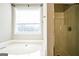 Bathroom with a shower and bathtub at 221 Stagecoach Pass, Temple, GA 30179