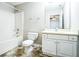 Bathroom with a shower/tub combo and white vanity at 221 Stagecoach Pass, Temple, GA 30179