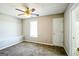 Charming bedroom with carpet, ceiling fan and window at 221 Stagecoach Pass, Temple, GA 30179