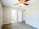 Spacious bedroom with carpet, ceiling fan, and access to multiple rooms at 221 Stagecoach Pass, Temple, GA 30179