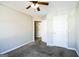 Bedroom with carpet flooring, ceiling fan, and walk-in closet at 221 Stagecoach Pass, Temple, GA 30179