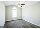 Well-lit bedroom with vaulted ceiling, ceiling fan and large arched window at 221 Stagecoach Pass, Temple, GA 30179