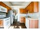 Kitchen with wood cabinets and stainless steel appliances at 221 Stagecoach Pass, Temple, GA 30179