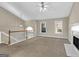 Open living room with a fireplace and loft view at 221 Stagecoach Pass, Temple, GA 30179