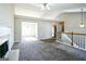 Spacious living room with a fireplace and high ceilings at 221 Stagecoach Pass, Temple, GA 30179