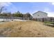 Fenced backyard with a playset and picnic table at 120 Emerson Trl, Covington, GA 30016