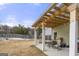Covered patio with table and chairs, overlooking a fenced backyard at 120 Emerson Trl, Covington, GA 30016