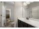Bathroom features a single vanity, a toilet, and a view of a bedroom at 120 Emerson Trl, Covington, GA 30016