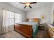 Bedroom with a wooden bed frame and decorative wall art at 120 Emerson Trl, Covington, GA 30016