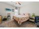 Spacious bedroom with a floral-print bed and a ceiling fan at 120 Emerson Trl, Covington, GA 30016