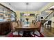 Elegant dining room with a large wood table and matching chairs at 120 Emerson Trl, Covington, GA 30016