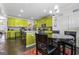 Kitchen with lime green cabinets, granite counters, and an island at 120 Emerson Trl, Covington, GA 30016