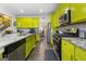Kitchen with lime green cabinets and granite countertops at 120 Emerson Trl, Covington, GA 30016