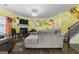 Living room with hardwood floors, fireplace and large sectional sofa at 120 Emerson Trl, Covington, GA 30016