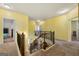 Upstairs hallway with stairs, carpet flooring, and access to bedrooms at 120 Emerson Trl, Covington, GA 30016