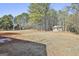 Large backyard with shed and wooded area at 234 Willis Rd, Sharpsburg, GA 30277