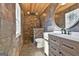 Bathroom with stone shower and modern vanity at 234 Willis Rd, Sharpsburg, GA 30277