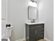 Modern bathroom with dark vanity and mirror at 234 Willis Rd, Sharpsburg, GA 30277