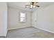 Bright bedroom with neutral walls, carpet, and a ceiling fan at 234 Willis Rd, Sharpsburg, GA 30277