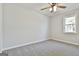 Bright bedroom with ceiling fan and carpet at 234 Willis Rd, Sharpsburg, GA 30277