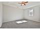 Spacious bedroom with ceiling fan and carpet at 234 Willis Rd, Sharpsburg, GA 30277