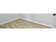 Image of a corner with new flooring and baseboards at 234 Willis Rd, Sharpsburg, GA 30277