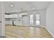 Modern kitchen with white cabinets, stainless steel appliances, and granite countertops at 234 Willis Rd, Sharpsburg, GA 30277
