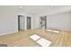 Open living area with hardwood floors and access to other rooms at 234 Willis Rd, Sharpsburg, GA 30277