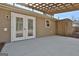Back patio with French doors and pergola at 234 Willis Rd, Sharpsburg, GA 30277