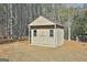 Tan colored storage shed in backyard at 234 Willis Rd, Sharpsburg, GA 30277
