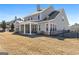 The back of the house featuring a cozy, covered patio and fenced yard at 244 Sturry Dr, Mcdonough, GA 30252