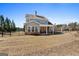 Spacious backyard featuring a covered patio and wrought iron fence at 244 Sturry Dr, Mcdonough, GA 30252