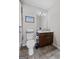 Cozy bathroom with vanity with white countertops, tile flooring, and art at 244 Sturry Dr, Mcdonough, GA 30252