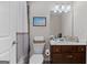Cozy bathroom with vanity with white countertops, tile flooring, and framed print art at 244 Sturry Dr, Mcdonough, GA 30252