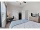 Bedroom featuring a ceiling fan, carpet, and a large window, and simple decor at 244 Sturry Dr, Mcdonough, GA 30252