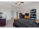 Spacious bedroom with neutral tones and a view into the adjoining bathroom and closet at 244 Sturry Dr, Mcdonough, GA 30252