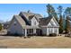 Charming gray two-story home featuring a covered front porch and nicely landscaped yard at 244 Sturry Dr, Mcdonough, GA 30252