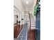 Bright foyer with high ceilings, hardwood floors, staircase, and runner at 244 Sturry Dr, Mcdonough, GA 30252