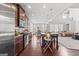 Open-concept kitchen features stainless steel appliances, granite countertops, and a large island with seating at 244 Sturry Dr, Mcdonough, GA 30252