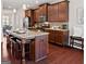 Kitchen featuring wooden cabinets, granite countertops, and stainless steel appliances at 244 Sturry Dr, Mcdonough, GA 30252