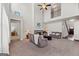 Large living room with fireplace, high ceilings, and comfortable seating at 244 Sturry Dr, Mcdonough, GA 30252