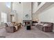 Spacious living room with high ceilings, fireplace, and comfortable seating at 244 Sturry Dr, Mcdonough, GA 30252