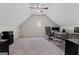 An empty office featuring vaulted ceilings, a ceiling fan, and large windows that provide natural light at 244 Sturry Dr, Mcdonough, GA 30252