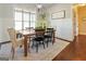 Charming dining area featuring a rustic wooden table and comfortable seating at 140 Elite Way, Mcdonough, GA 30252