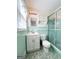 Clean bathroom with light green tile and a shower at 626 Barksdale Dr, Forest Park, GA 30297