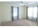 Well-lit bedroom featuring two windows with curtains at 626 Barksdale Dr, Forest Park, GA 30297