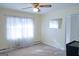 Bedroom with large window and ceiling fan at 626 Barksdale Dr, Forest Park, GA 30297